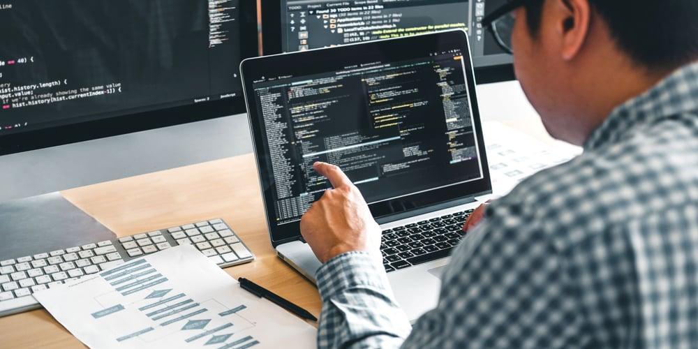 A Fullstack developer working on both frontend and backend tasks in a startup and enterprise setting, showcasing the differences in work environment and responsibilities.
