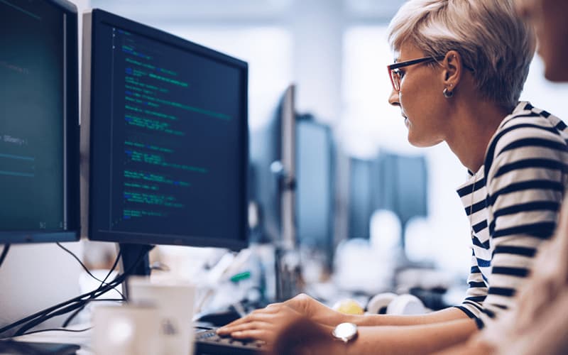 A Kubernetes engineer managing containerized applications in a cloud environment, showcasing the importance of Kubernetes in cloud computing jobs.