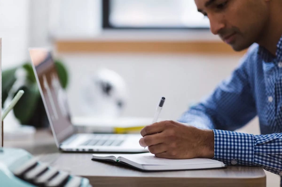 A young professional gaining project management experience through online training and hands-on projects without a formal job.