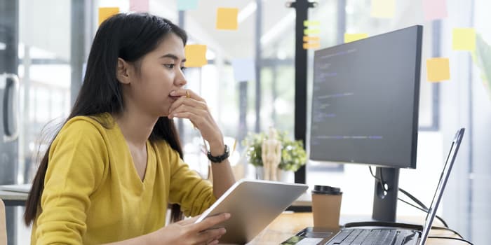 A data engineer working on cloud-based data pipelines and real-time analytics in a modern office