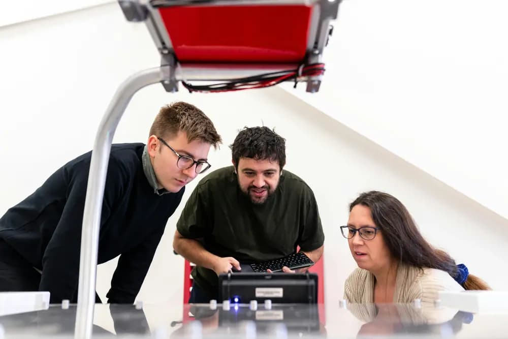 AI engineering students collaborating on machine learning project using modern tools, illustrating AI Engineering Program in 2026 and real-world AI development workflows