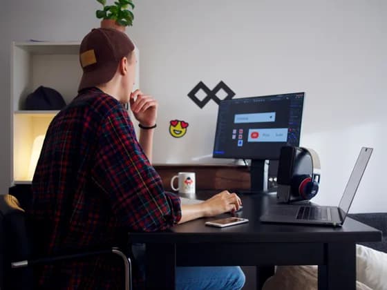 API Developer engineer working at a modern workstation, designing and testing secure APIs on a desktop computer in a professional software development environment in 2026.
