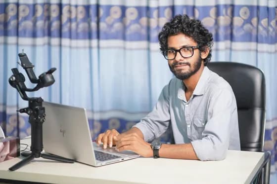 A software developer at work on a laptop