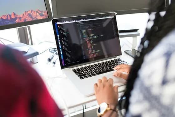 A data engineering mentor guiding trainees through a real-world project. Hands on experience whether via internships, bootcamps, or on the job training is invaluable for mastering data engineering skills