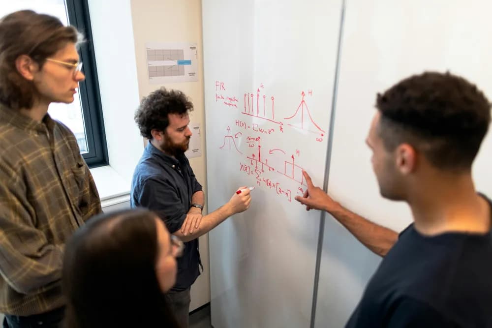 Data science and AI engineering students collaborating on machine learning models and data analysis at Refonte Learning, preparing for real-world data science & AI engineering careers in 2026.