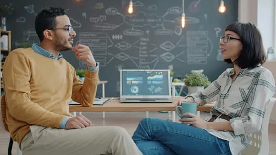 Teams of data science engineers collaborate on extracting insights from data in a modern office. In 2026, data projects are often cross-functional, requiring collaboration between analysts, engineers, and domain experts to turn raw data into real-world solutions.