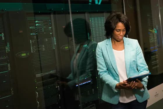 A database administrator checks on servers in a secure data center. In 2026, DBAs often work closely with infrastructure and security teams to monitor database environments. Regular audits of both systems and configurations help ensure that performance and security go hand-in-hand. For example, a DBA might review server metrics and access logs daily to catch anomalies early. Balancing fast performance with strong security measures is a critical part of the DBA’s role