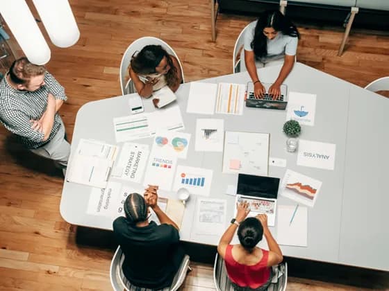 A digital marketing team collaborates on campaign strategy using data and creative ideas. In 2026, successful marketing requires a blend of analytical insight and human creativity