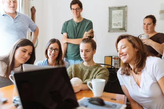 A team of web developers collaborating on a front-end project in a modern workspace. Figure: Front-end development teams are embracing new tools and practices to build better user experiences