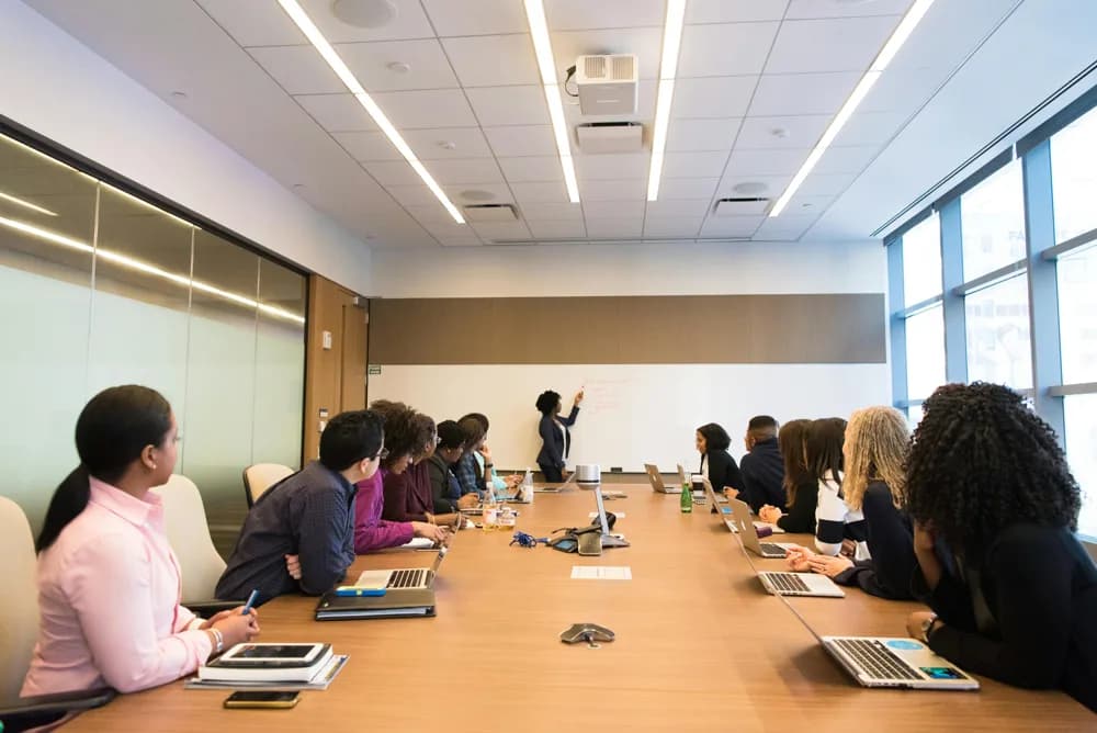 Young professionals in a data analytics training session preparing for business analyst careers in 2026