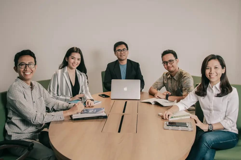 Diverse group of professionals collaborating on a jurimetric & AI project with laptops and documents, showcasing data-driven legal analysis and innovation in jurimetric & AI in 2026 with Refonte Learning