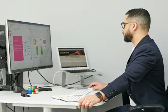 A marketing professional monitors brand mentions and customer feedback across multiple screens. In 2026, businesses must keep constant watch on their online reputation across search engines, social media, and review platforms to quickly address issues and maintain trust.