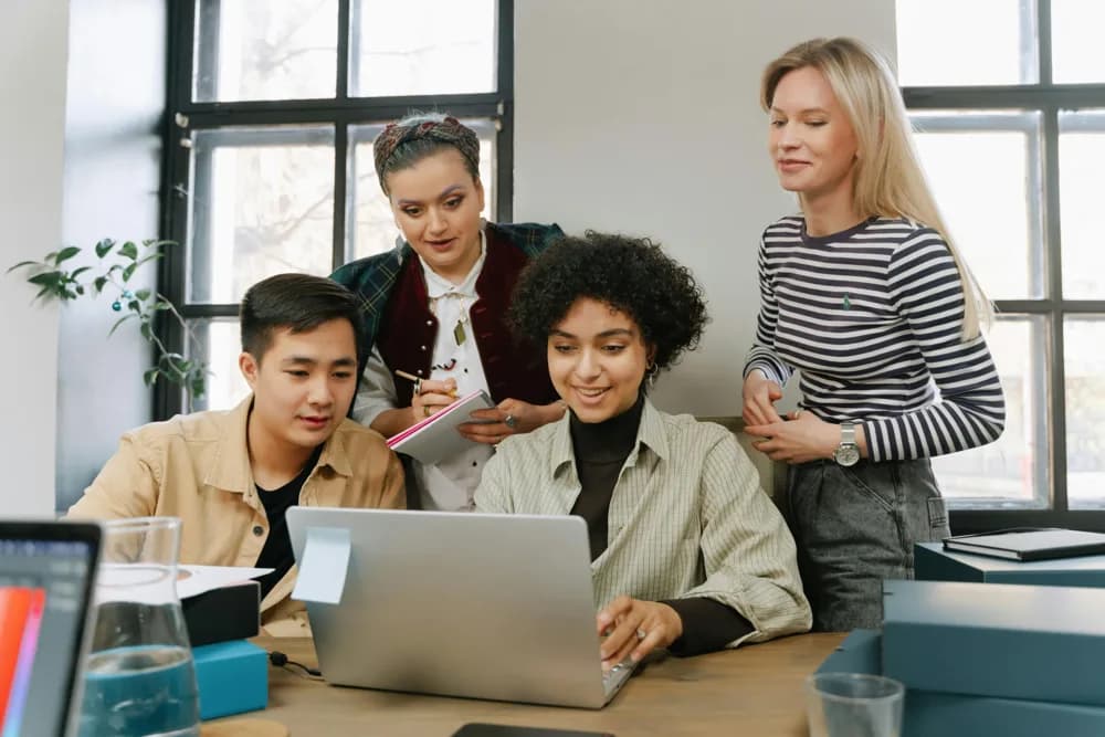 A diverse group of professionals collaborating on an AI project in 2026. Reinforcement learning (RL) has evolved from a niche research topic into a driving force behind some of today’s most advanced AI systems