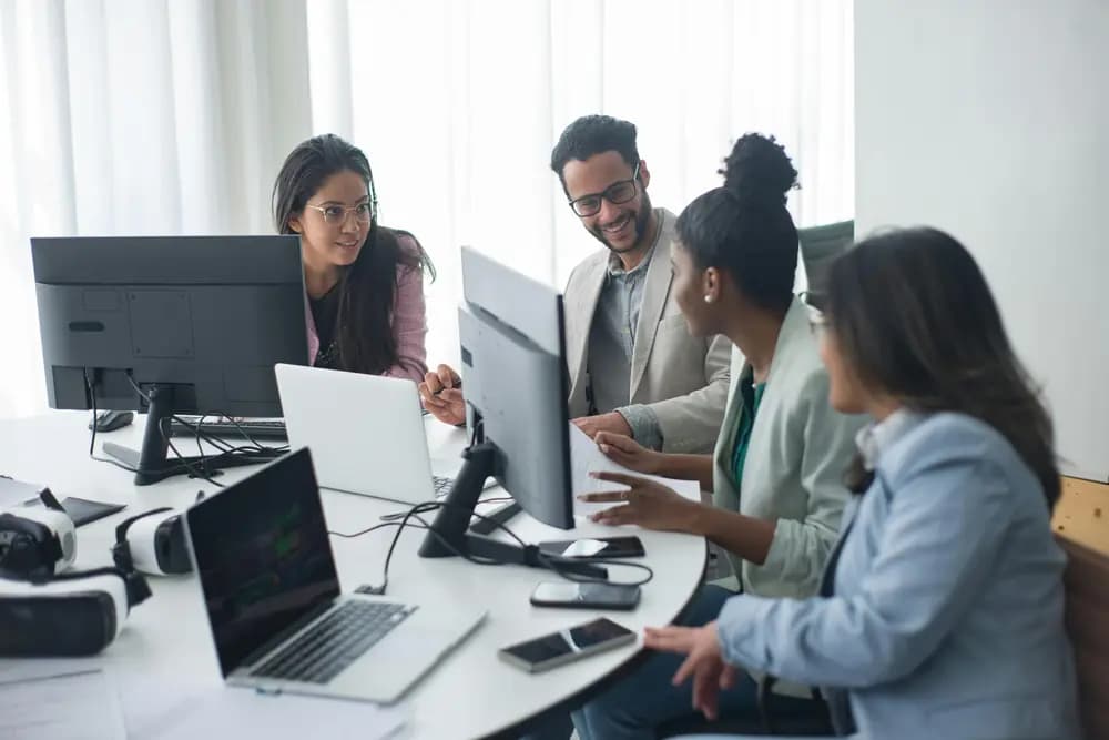 Tech professionals collaborating on modern software development and digital transformation projects in a modern office environment