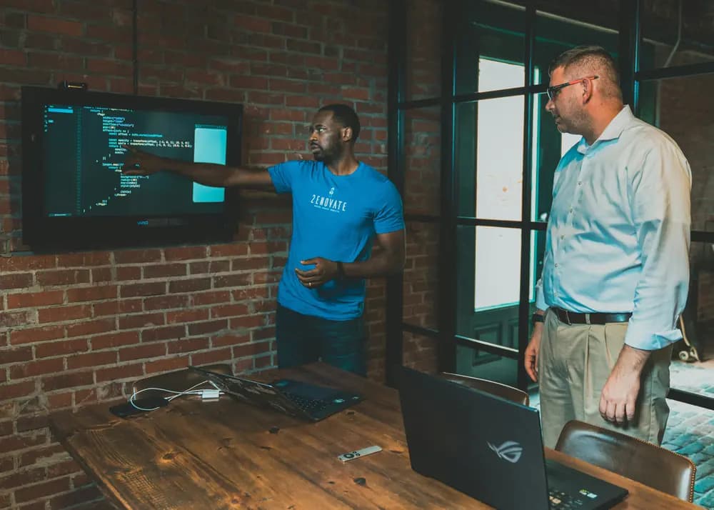 Professional system administrators working on server automation and DevOps infrastructure with Ansible, illustrating system-administration engineering in 2026 and cloud computing practices