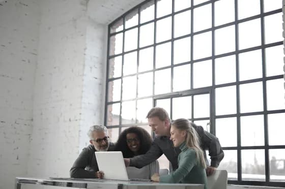 A team of IT professionals collaborating to manage enterprise systems