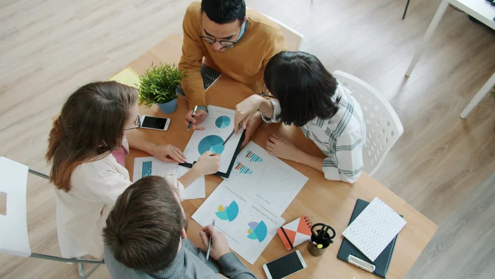 A team of data scientists collaborating on data analysis tasks, reflecting the interdisciplinary and team-driven nature of modern data science.