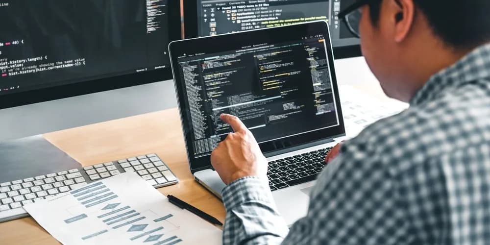 A Fullstack developer working on both frontend and backend tasks in a startup and enterprise setting, showcasing the differences in work environment and responsibilities.